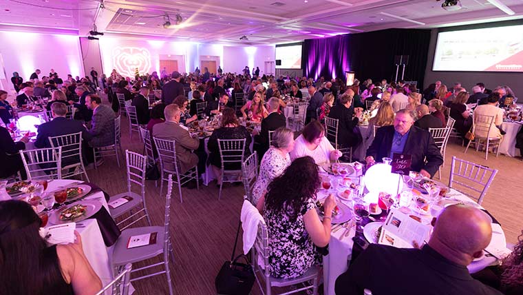 Attendees seated at tables during the Bears of Distinction dinner.