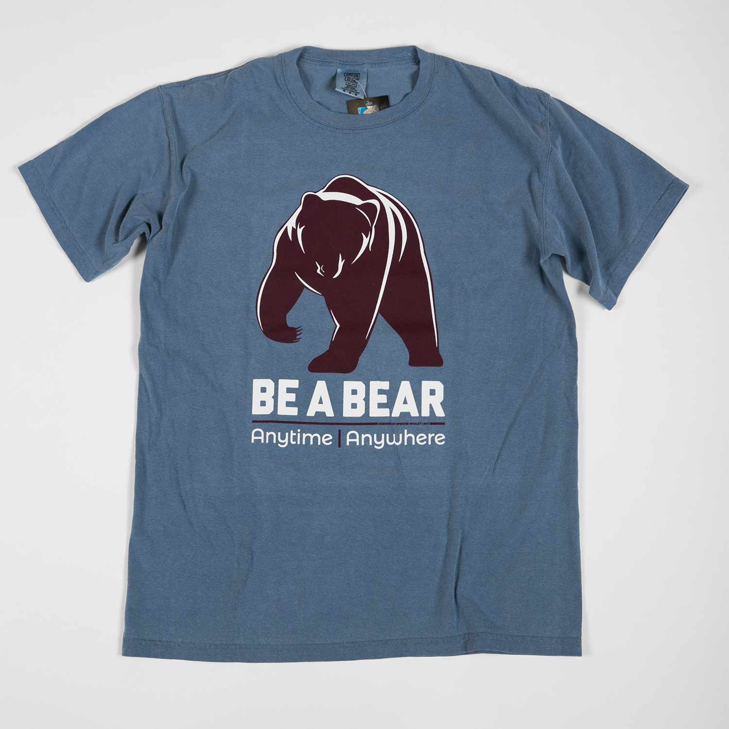 A blueish gray Be a Bear T-shirt from a past contest. A large, maroon silhouette of a Bear is shown over the words "Be a Bear. Anytime. Where"
