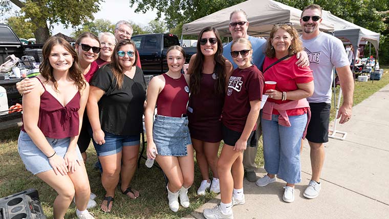 Family and friends at the homecoming tailgate.