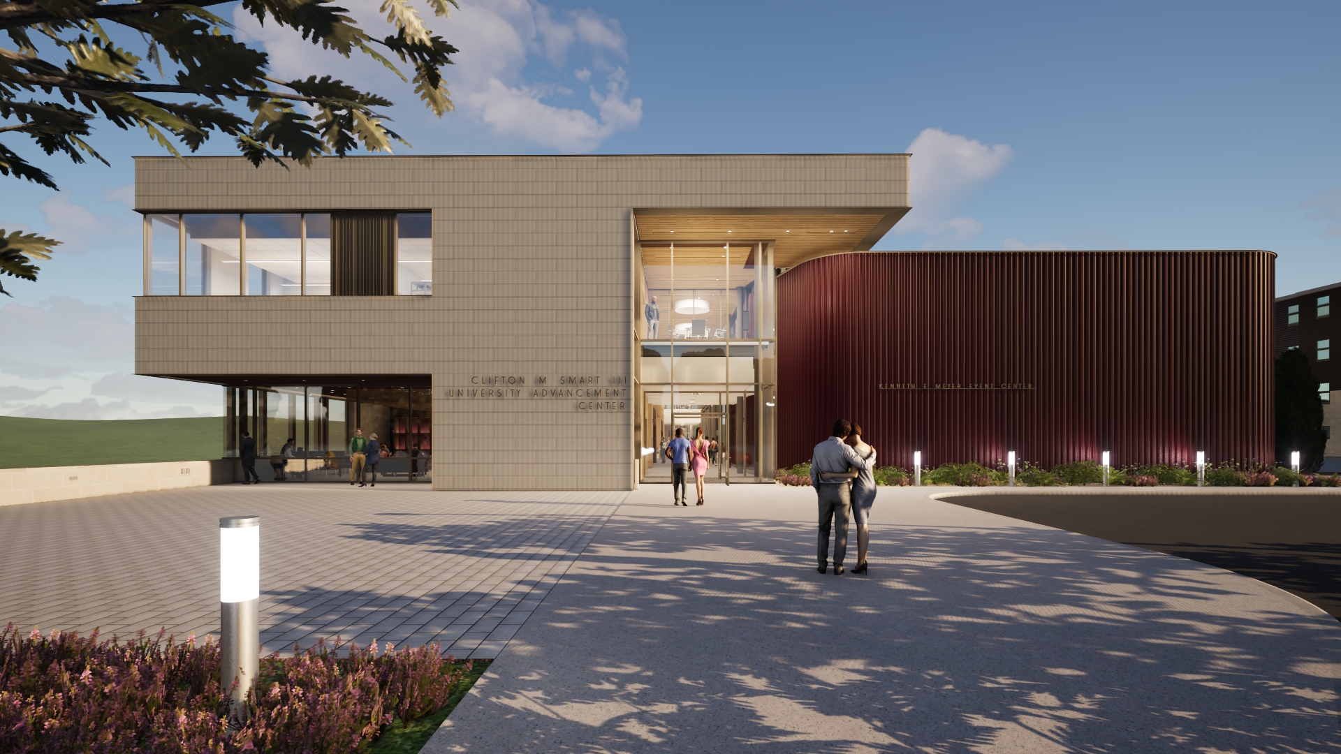 Modern university building: a light brown, paneled 'University Advancement Center' with large glass, connected to a curved, dark red ribbed 'Event Center.' People on paved plaza, under blue sky, tree branches left.