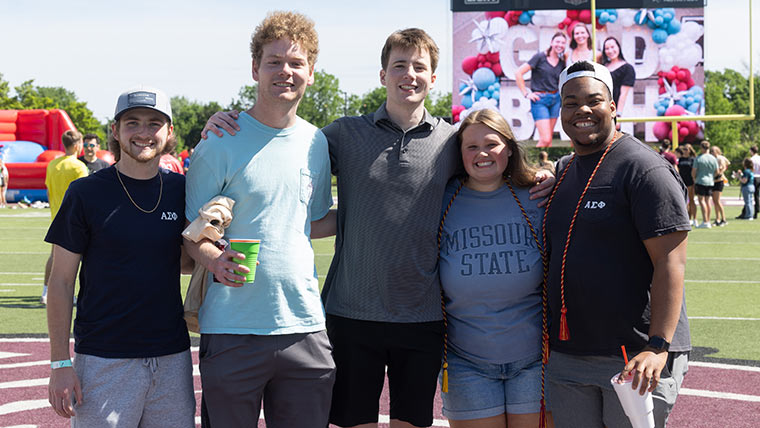 Five soon-to-be #BearGrads pose for a group photo at Grad Bash.