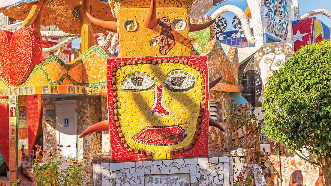 Decorative art and figures on a building in Cuba.