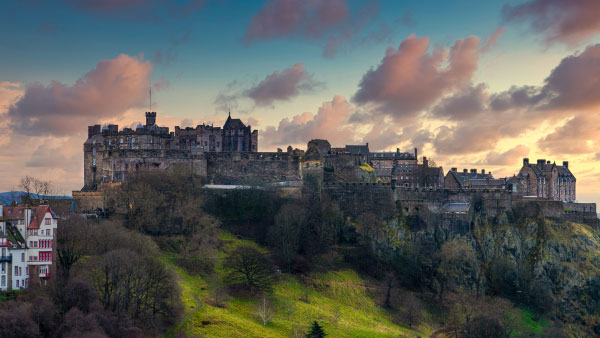 A castle atop a hill in Scotland.