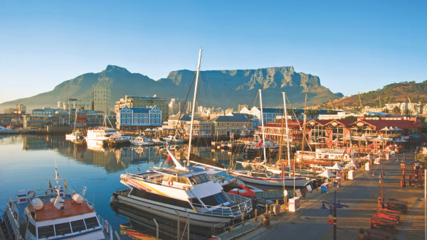 Boats fill a seaside port in South Africa.