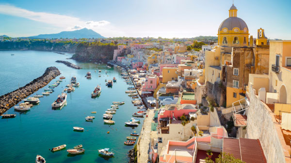 A breathtaking, aerial view of a bay and seaside community in Southern Europe.